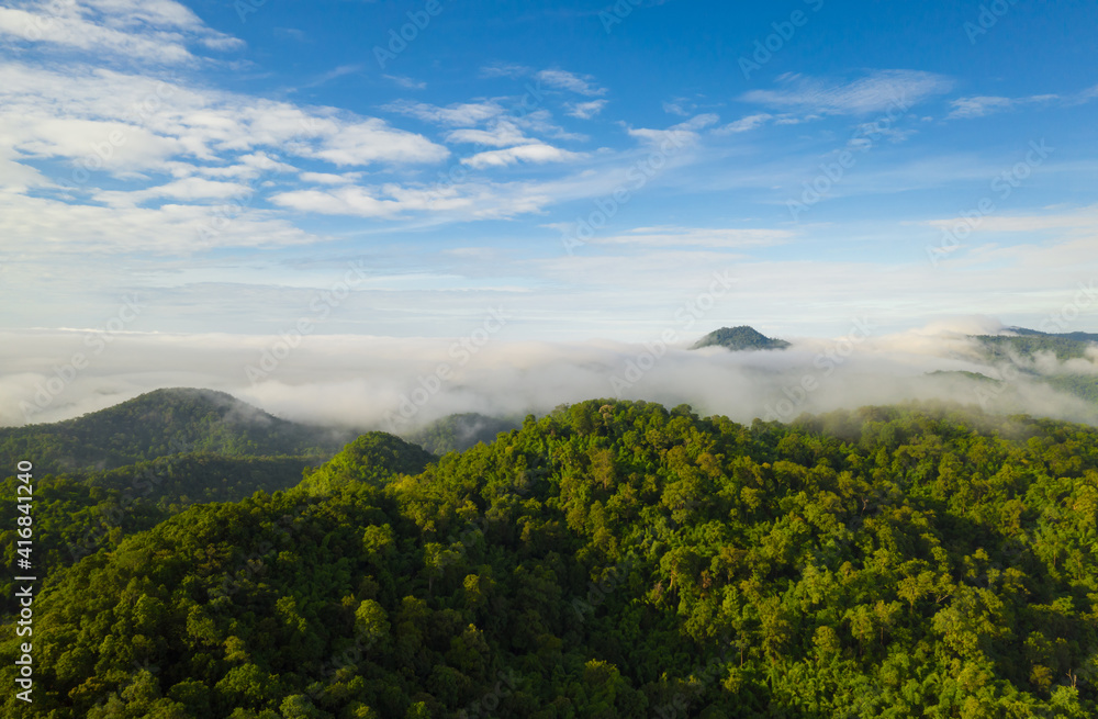 Aerial view Beautiful of morning scenery sea of cloud and the fog flows on high mountains.