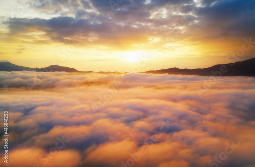 Aerial view Beautiful of morning scenery sea of cloud and the fog flows on high mountains.