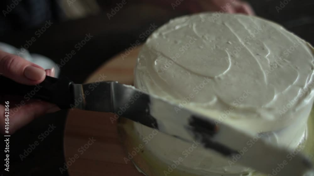 cooking of white cream cake, forming with putty knife cooking of white cream cake, forming with putty knife