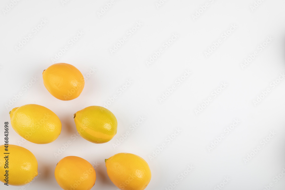 Fresh ripe yellow lemons on white background Fresh ripe yellow lemons on white background