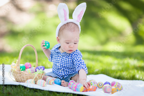 Canvas Print Mixed Race Chinese and Caucasian Baby Boy Outside Wearing Rabbit Ears Playing wi