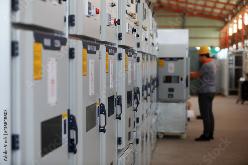 Workers are assembling mechanical parts on the production line