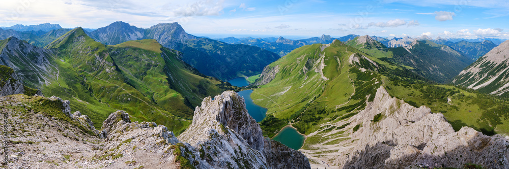View from Lachenspitze mountain peak towards Traualpsee and Vilsalpsee lakes, at the end of the via ferrata tour. Panorama, adventure, Summer, Austria.