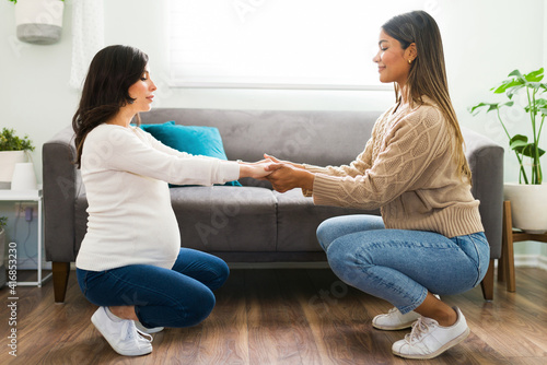 Midwife preparing an expectant mother for labor and childbirth photo