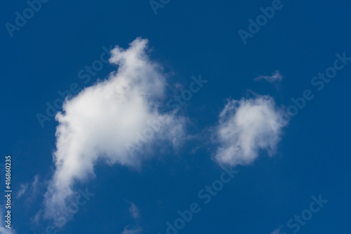 Cluster of clouds on deep blue sky background
