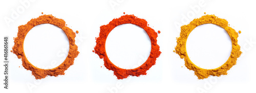 set of spices powders, coriander, Chilli pepper and turmeric pile arranged in round blank frame and border circle isolated on white background, top view