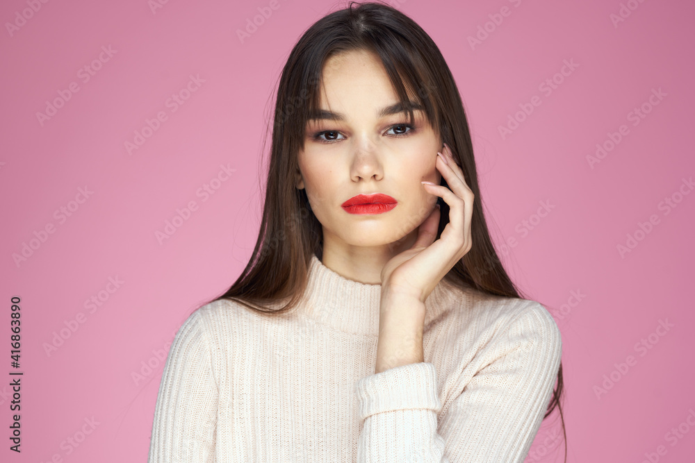 Beautiful brunette red lips white blouse close-up attractive view pink background Beautiful brunette red lips white blouse close-up attractive view pink background