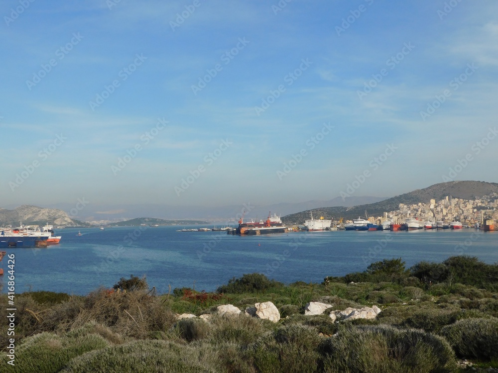 The strait between Attica and the Salamis island, where the famous sea battle of 480 BC took place, viewed from the burial mound of the fallen Greeks. The city of Perama in the background