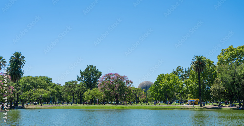 Artificial lagoon that limits one of the parks in the forests of Palermo, Buenos Aires. in the background you can see the planetarium.