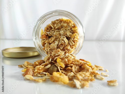 Corn Flakes, Muesli with fruits in a bottle © Carrot