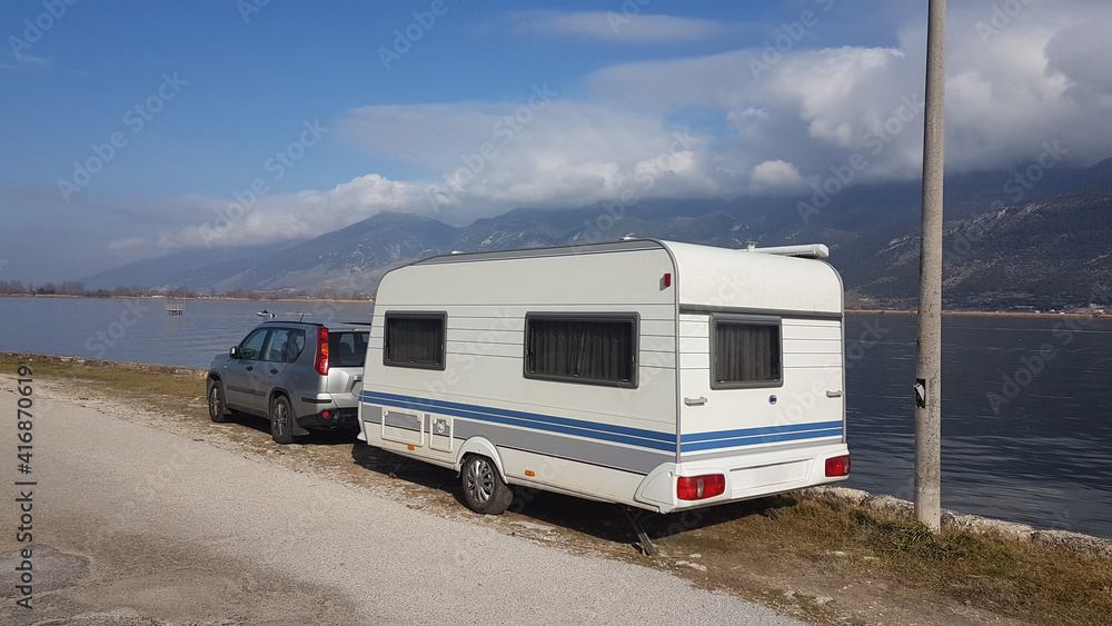 caravan car beside sea in spring caravan car beside sea in spring