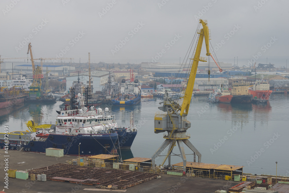 January foggy morning in Ilyich Bay. Cargo port of Baku