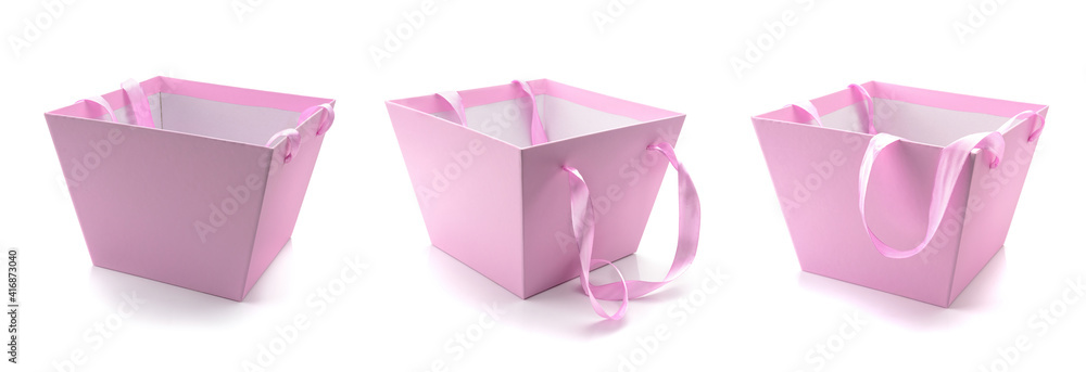 three pink empty gift boxes isolated on a white background three pink empty gift boxes isolated on a white background