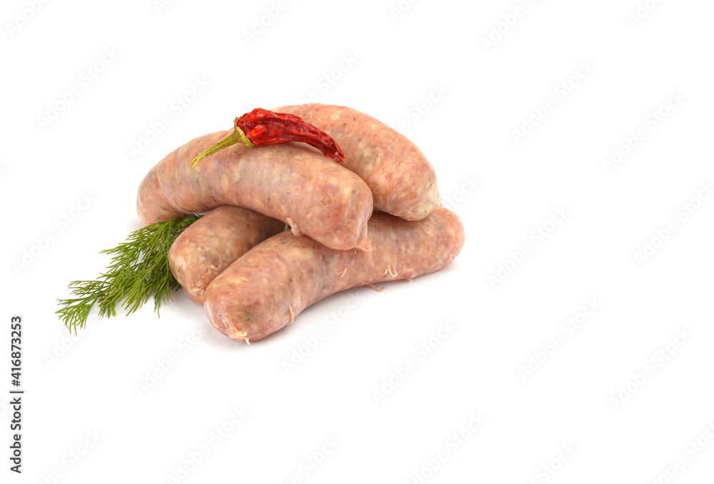 Raw pork sausages. Grilled sausages, spices close-up, isolated on a white background.Selective focus. Raw pork sausages. Grilled sausages, spices close-up, isolated on a white background.Selective focus.