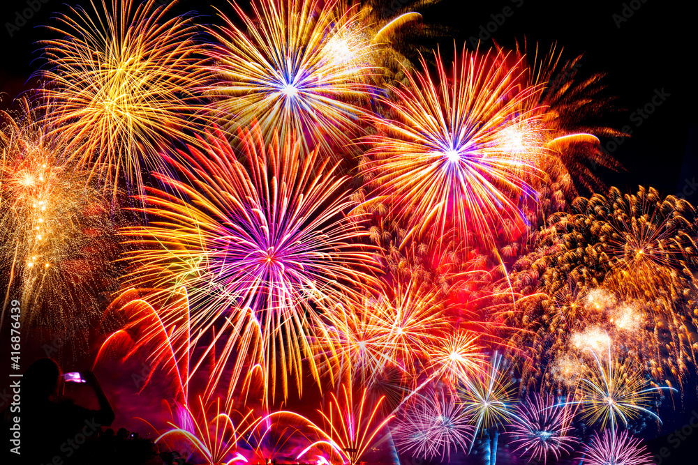 The crowd of Silhouette watching firework isolated display for celebration happy new year and merry christmas on black isolated background