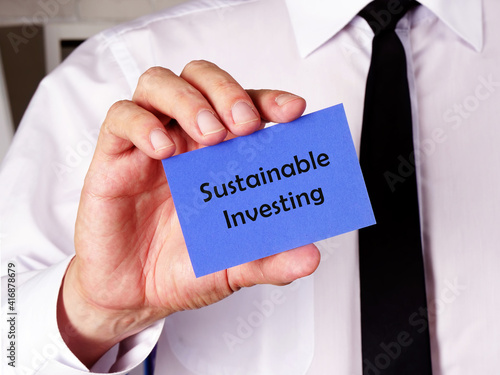 Conceptual photo about Sustainable Investing with handwritten text.