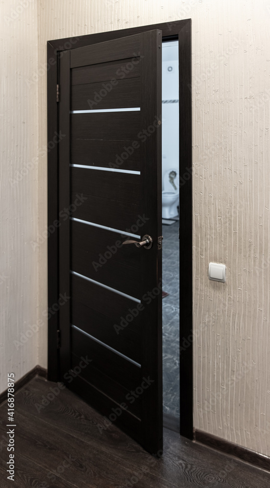 Dark wooden doors in the room. Background Dark wooden doors in the room. Background