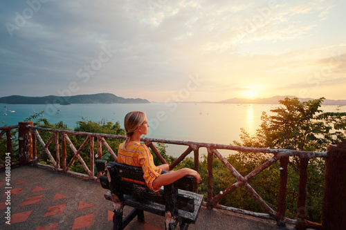 Wallpaper Mural Traveling by Thailand. Young woman enjoying wonderful sunset on Phuket island view point. Torontodigital.ca