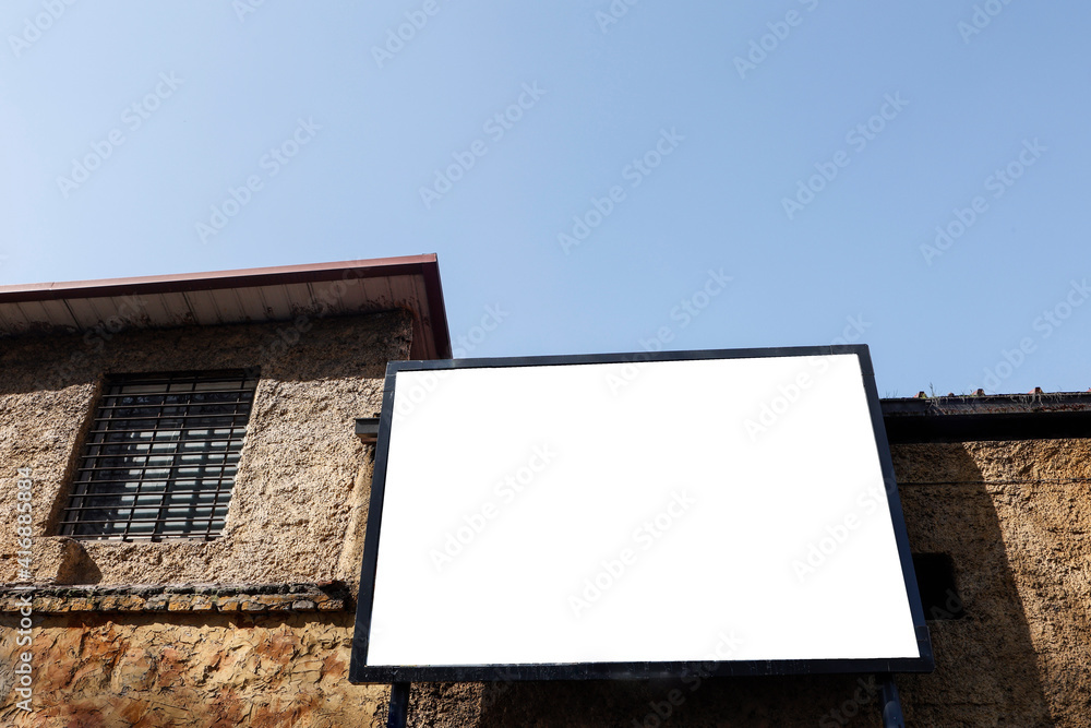 Large blank billboard on the street in the city, mock up - Image Large blank billboard on the street in the city, mock up - Image