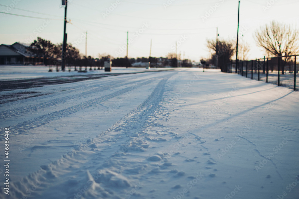 Neighborhood road covered in snow Neighborhood road covered in snow