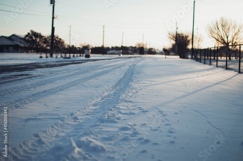 Neighborhood road covered in snow 