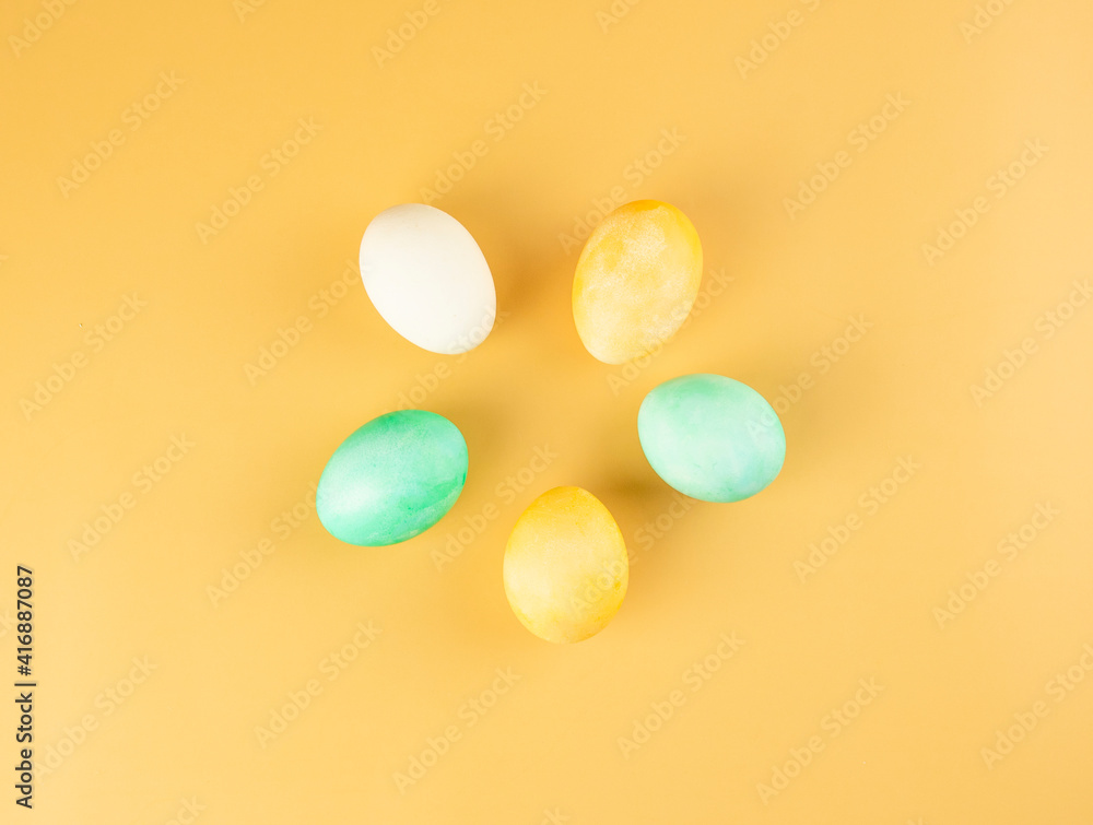 Easter eggs composition in the form of a flower. orange background Easter eggs composition in the form of a flower. orange background