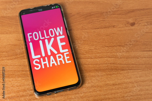 Follow Like Share - Phone on table
