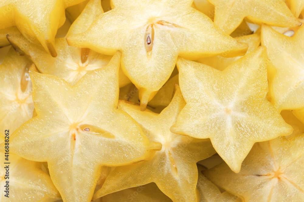 Pile of delicious carambola slices as background, top view Pile of delicious carambola slices as background, top view