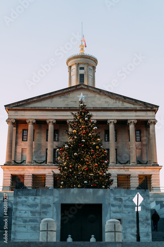 Christmas tree and lights in front of Tennessee State Capitol building in the evening in Nashville.