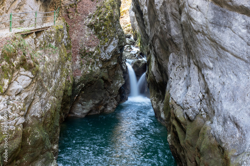 Waterfall in the Areuse gorge surrounded by steep cliffs  switzerland.