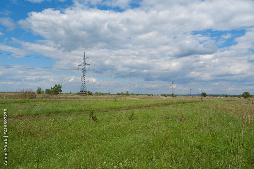 Power transmission towers and clouds Power transmission towers and clouds
