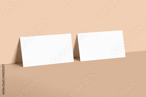 wall supported business card mockup with shadows