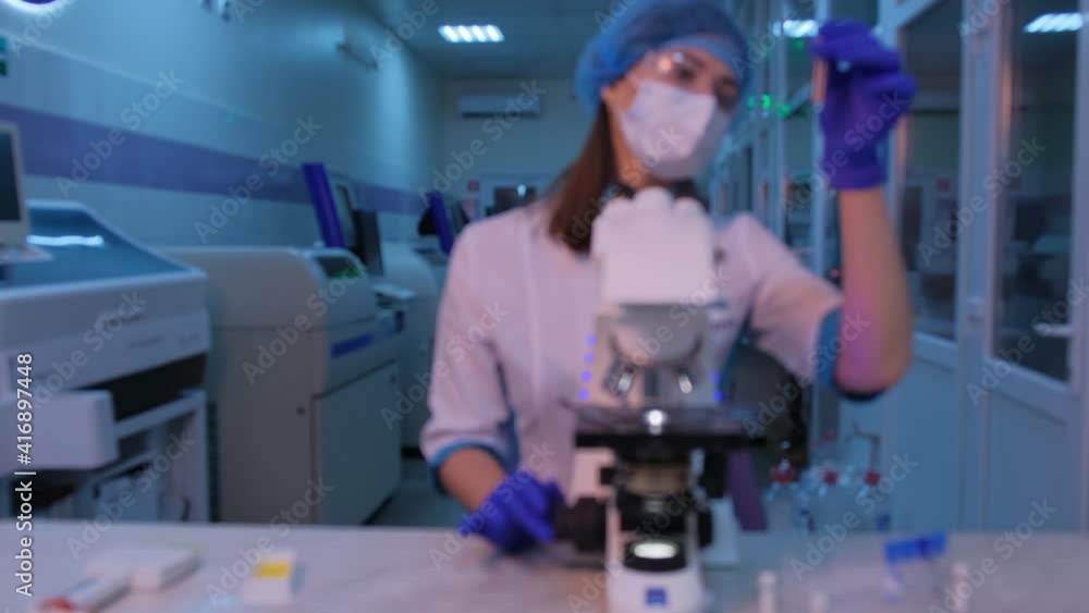 Blurred video. A nurse in the laboratory checks the tests. Blurred video. A nurse in the laboratory checks the tests.