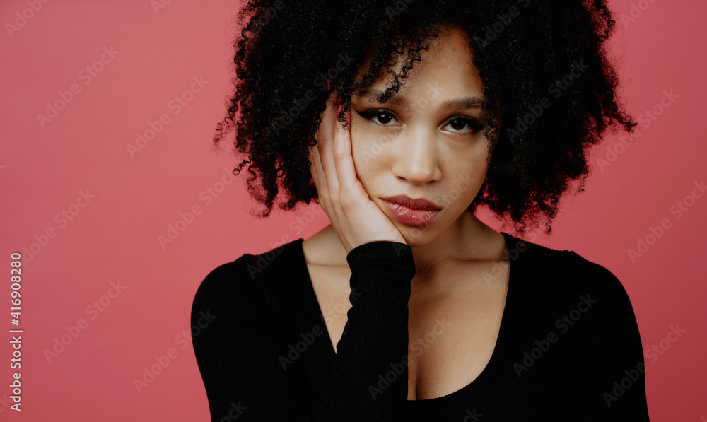 sad mood tired. beautiful young woman of afro appearance. smiling posing in a photo studio. Copy space. sad mood tired. beautiful young woman of afro appearance. smiling posing in a photo studio. Copy space.