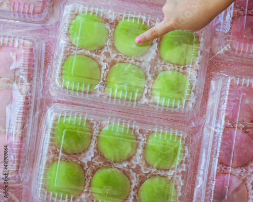 Japanese dessert colourful mochi in a clear packging containers. photo