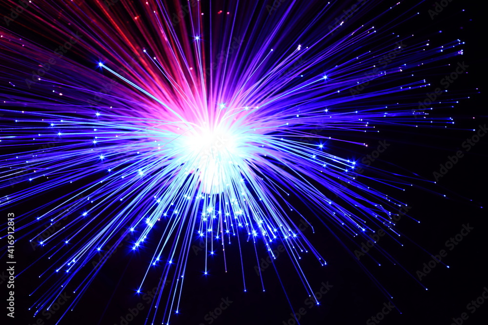 Light explosion effect background. Flying lights purple, red, blue. Big bang effect. Fireworks.
