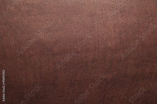 A beautiful brown color handmade paper of rough texture with veins and fibers. Useful for background, 3d rendering.