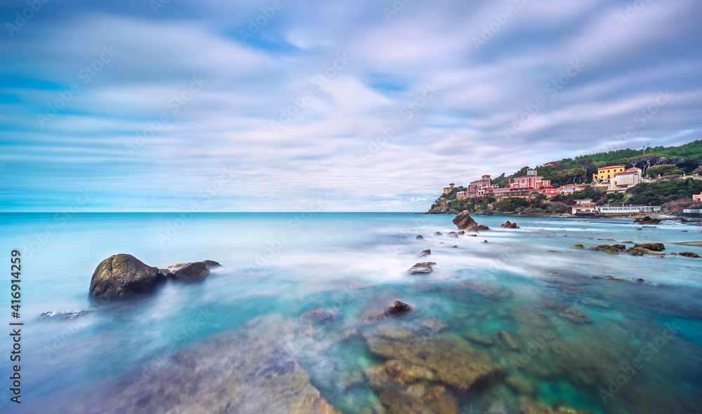 Rocks and soft sea, long exposure photography landscape. Castiglioncello, Italy