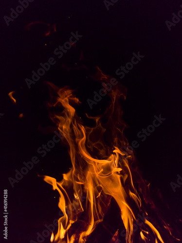 Flame on a black background. Fire on black. Brightly  heat  light  camping  big bonfire. 