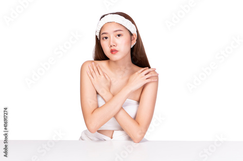 Clean fresh beautiful young Asian woman with fresh skin on white background. Beautiful Girl beauty face care and Facial treatment. Woman with clear skin isolated on white.