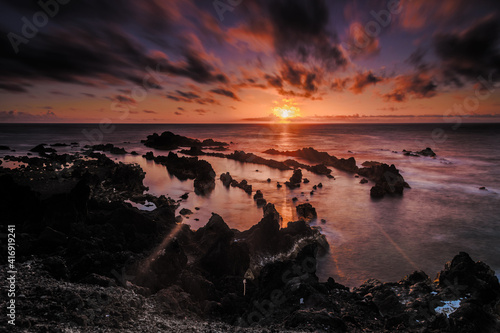 sunset on the ocean panorama of the coast in azores islands during sunset. portugal