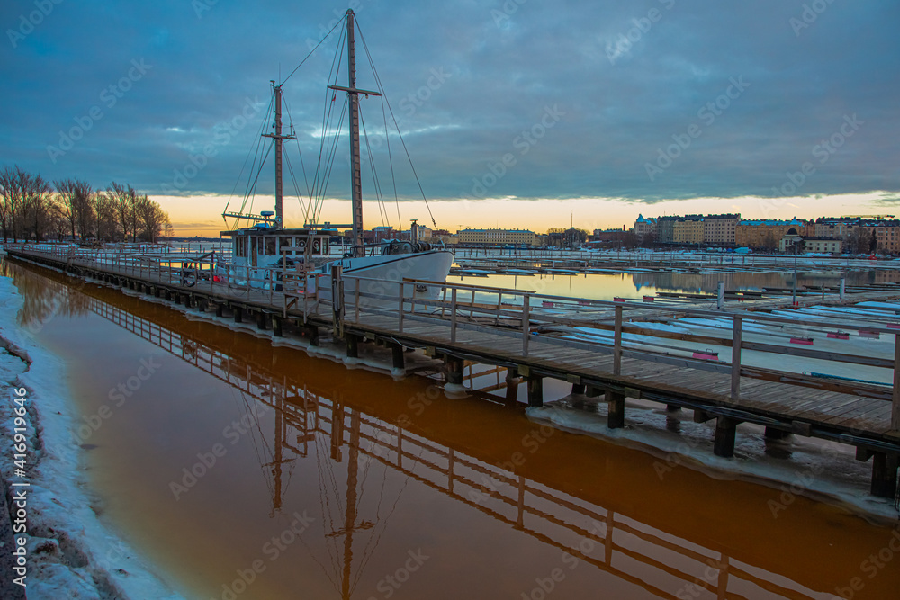 Finland, Helsinki, February 26, 2021
  Spring panorama of Helsinki, view of the Katajanokka and Krununhakka area in the foreground the Gulf of Finland and berths for boats