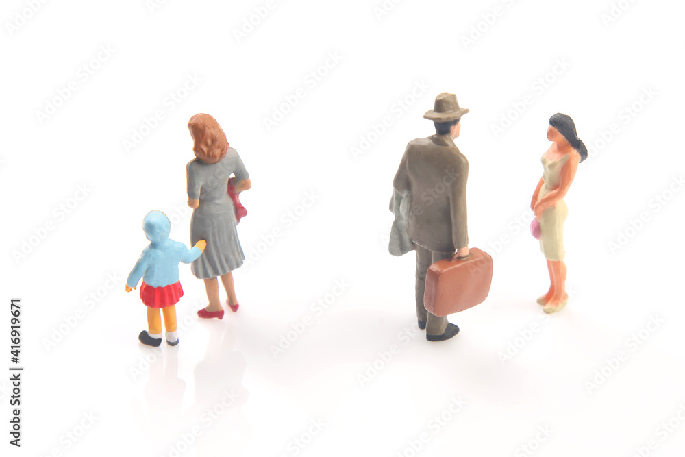 miniature people. concept of family people in relationships on a white background. the problem of fidelity in marriage. raising children in problematic relationships in the family. miniature people. concept of family people in relationships on a white background. the problem of fidelity in marriage. raising children in problematic relationships in the family.