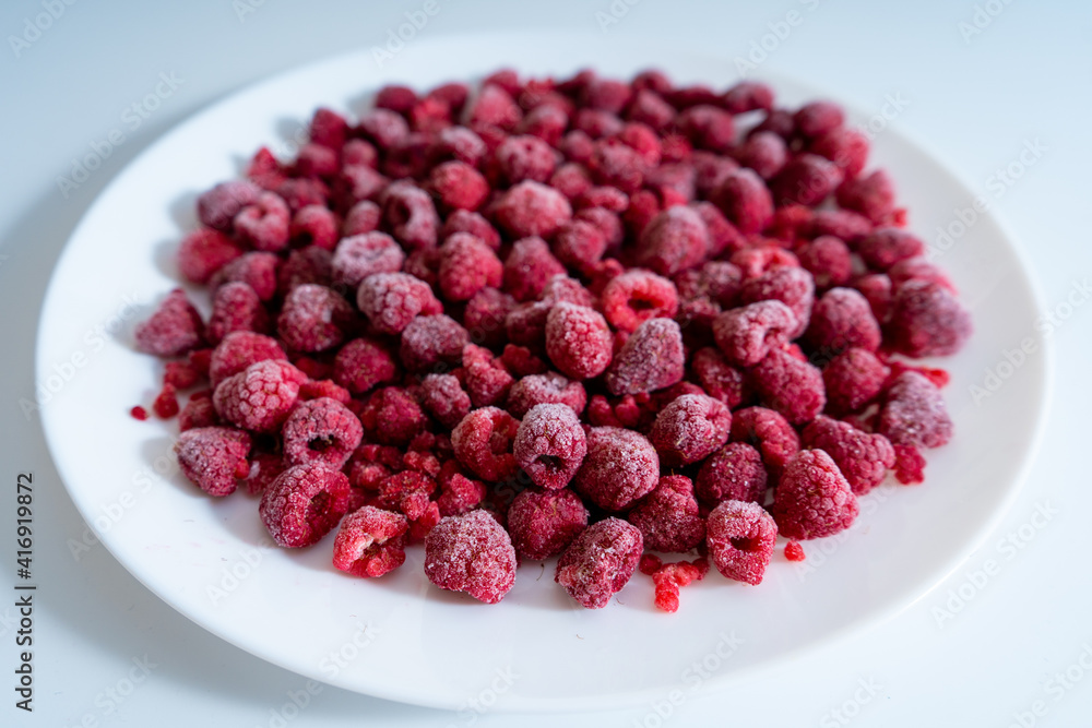 Frozen raspberries, berries background. Selective focus Frozen raspberries, berries background. Selective focus