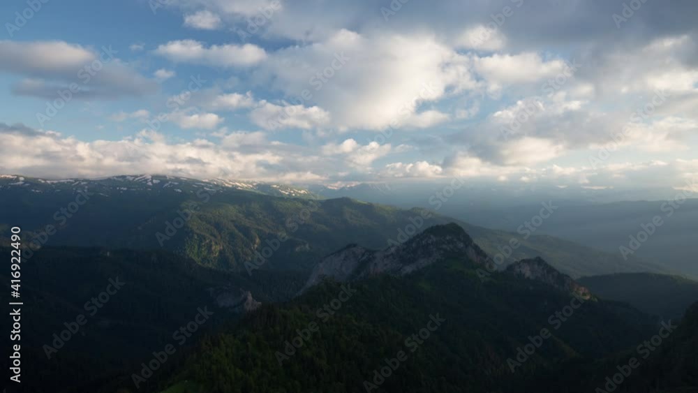 The formation and movement of clouds over the summer slopes of Adygea Bolshoy Thach and the Caucasus Mountains The formation and movement of clouds over the summer slopes of Adygea Bolshoy Thach and the Caucasus Mountains