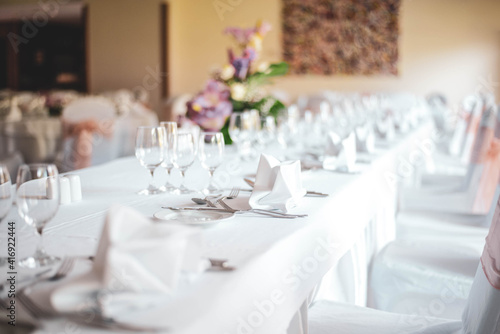 served wedding table with flowers centerpiece and glasses