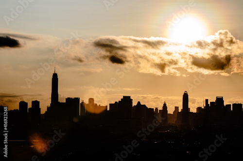 Aerial view of silhouette city dramatic sunset or sunrise and golden sky in Bangkok Thailand © Nattawat