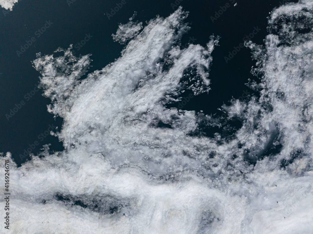 Ice melts on the river. Ice crack. Aerial drone view. Spring sunny morning. Ice melts on the river. Ice crack. Aerial drone view. Spring sunny morning.