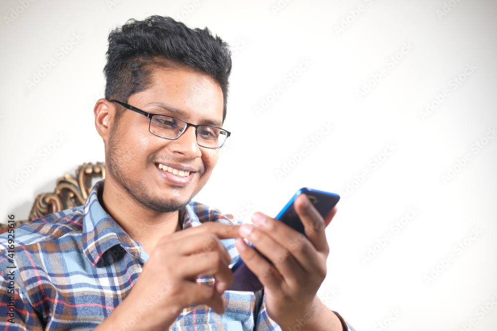  happy young man hand using smart phone.