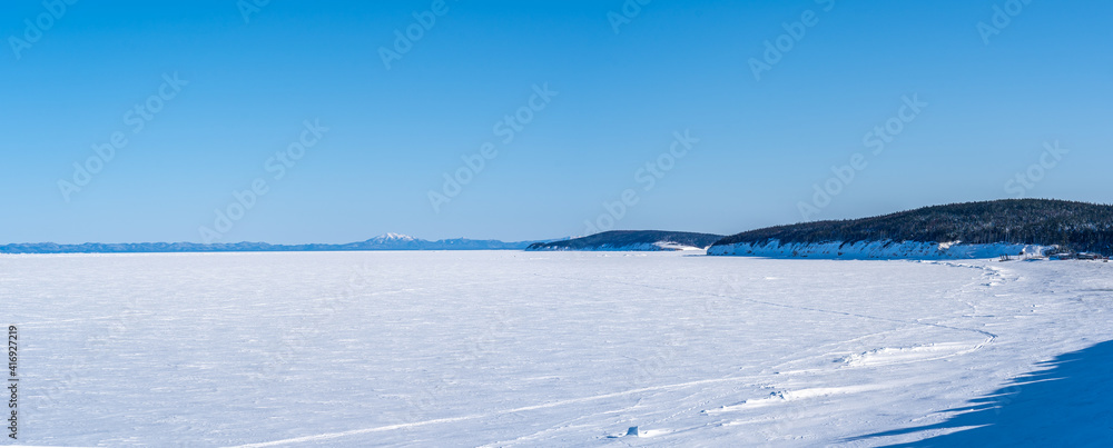 Winter sea covered with ice. Panorama